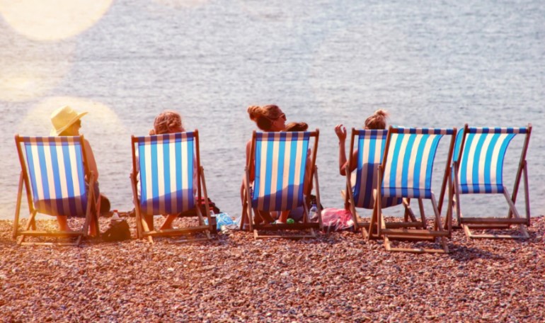 Relaxing on sun loungers